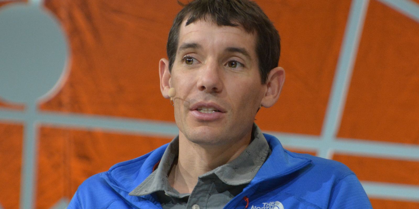 Climber Alex Honnold smiling at an outdoor event