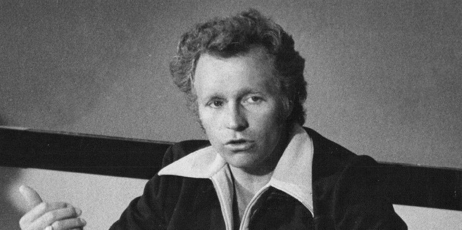 Evel Knievel in his white star-spangled jumpsuit with a motorcycle